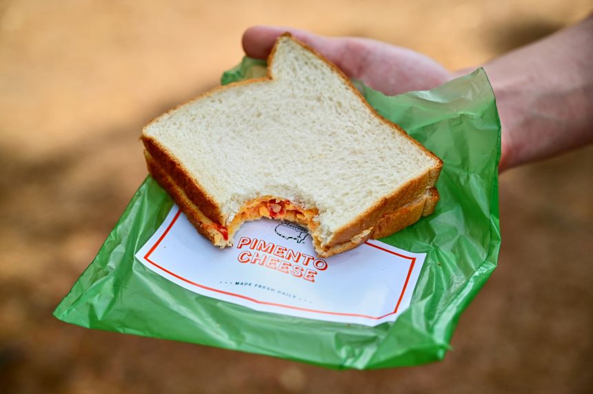 Affordable pimento cheese sandwiches are part of the experience at the Masters Tournament at Augusta National Golf Club in Georgia.