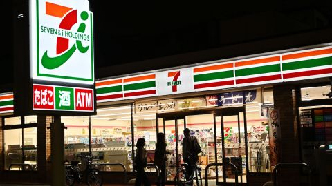 This photo taken on April 21, 2019 shows the exterior of a 7-Eleven convenience store at night in Tokyo. - The much-loved stores are now at the centre of a row over whether they should stay open 24/7/365 -- a debate that strikes at the heart of crippling labour shortages in ageing Japan. (Photo by CHARLY TRIBALLEAU / AFP) / TO GO WITH Japan-labour-social,FOCUS by Anne BEADE and Natsuko FUKUE        (Photo credit should read CHARLY TRIBALLEAU/AFP via Getty Images)