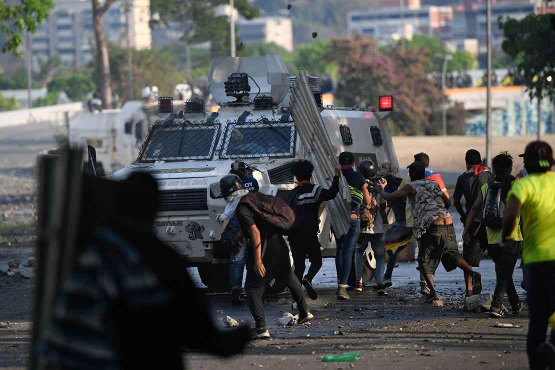 Anti-government protesters clash with security forces in Caracas on May 1, 2019.