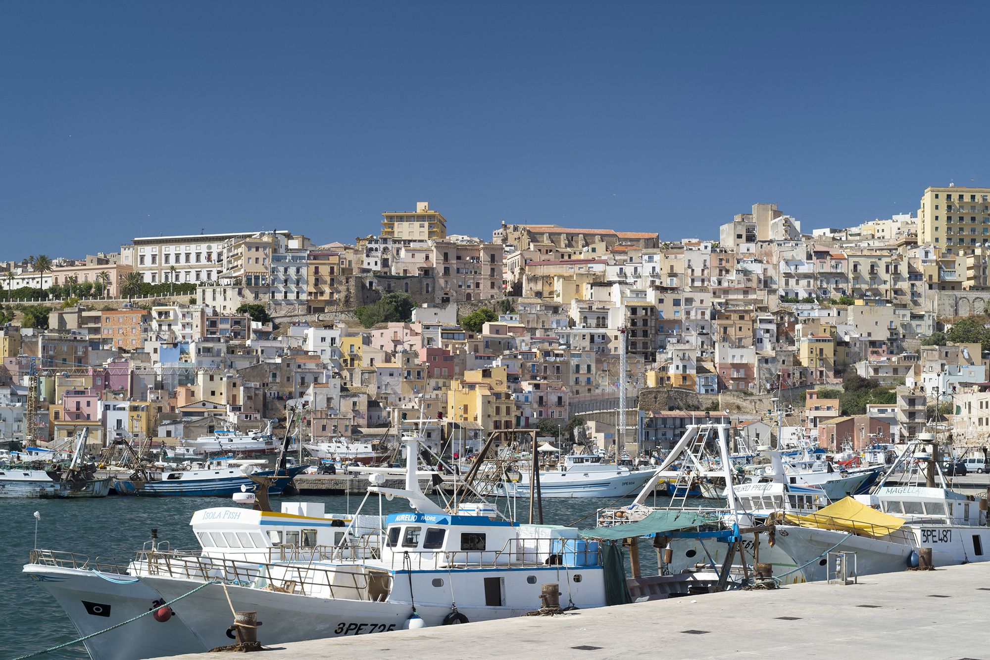 Fishing boats docked at port in Sciacca in southern Sicily. The town is known for its ceramics, hot springs and religious festivals.