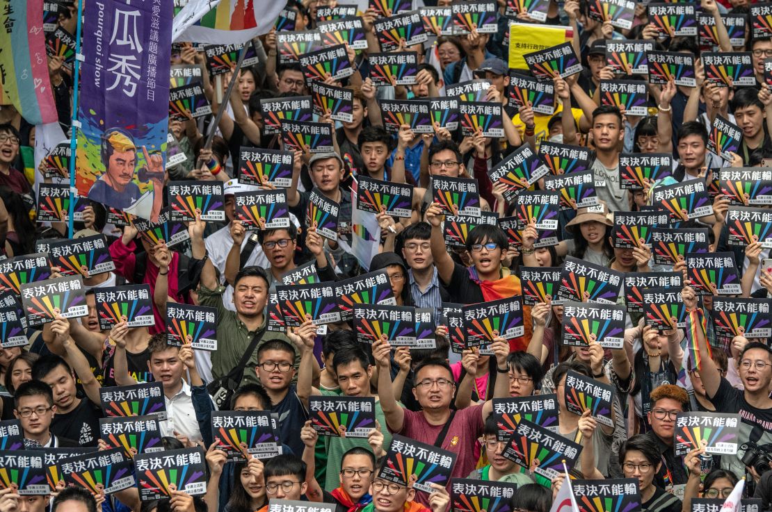 People hold posters as they gather outside Taiwan's parliament ahead of a vote on legalizing same-sex marriage on May 17, 2019 in Taipei, Taiwan.