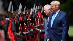 US President Donald Trump inspects a guard of honour with then-Prince Charles at Buckingham Palace during his first state visit in 2019.