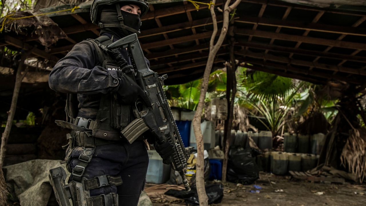 A Sinaloa's state police officer works during the dismantle of one of the three clandestine laboratories producers of synthetic drug, mainly methamphetamine in El Dorado, Sinaloa state, Mexico on June 4, 2019. (Photo by RASHIDE FRIAS / AFP)        (Photo credit should read RASHIDE FRIAS/AFP via Getty Images)