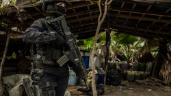 A Sinaloa's state police officer works during the dismantle of one of the three clandestine laboratories producers of synthetic drug, mainly methamphetamine in El Dorado, Sinaloa state, Mexico on June 4, 2019. (Photo by RASHIDE FRIAS / AFP)        (Photo credit should read RASHIDE FRIAS/AFP via Getty Images)