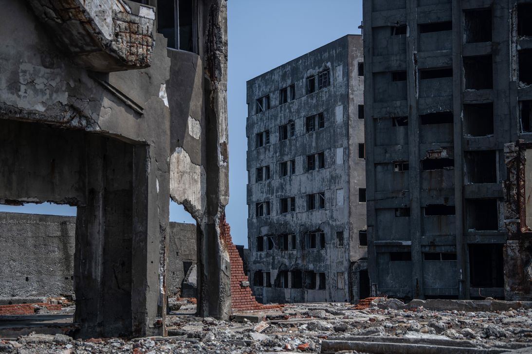 Buildings lie in ruins on Hashima Island near Nagasaki, Japan, now a popular tourist destination after being abandoned for more than 30 years