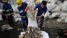 Staff and Workers from the recycle company Blue Waste 2 Value showing the waste garbage's towards media collected from Mount Everest and Base Camp in Kathmandu, Nepal on Wednesday, June 05, 2019. Clean-up Campaign 2019 on Mount Everest removes 24,000lbs of rubbish and four dead bodies. (Photo by Narayan Maharjan/NurPhoto via Getty Images)
