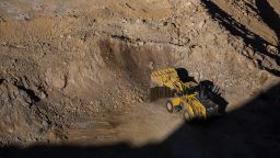 A wheel loader moves raw ore inside the pit at the Mountain Pass mine, operated by MP Materials, in Mountain Pass, California.