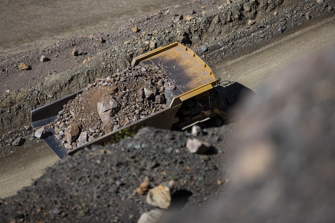 A dump truck moves raw ore inside the pit at the Mountain Pass mine, operated by MP Materials, in Mountain Pass, California, on June 7, 2019.