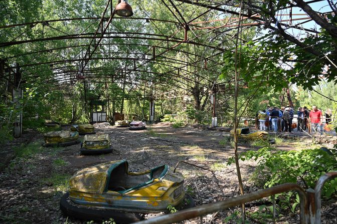 Visitors walk in the ghost city of Pripyat during a tour in the Chernobyl exclusion zone, the site of Ukraine's 1986 nuclear disaster.