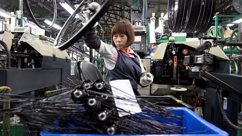A worker checking e-bike parts at the factory of Giant, the world's biggest bicycle manufacturer, in Taichung, Taiwan, on May 21, 2029.