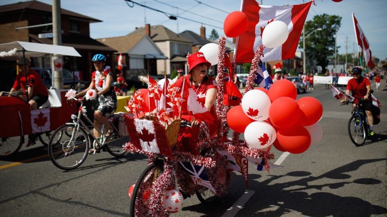 TORONTO, ON - JULY 01: A festive cyclist rides in the East York Canada Day Parade on July 1, 2019 in Toronto, Canada. Canada Day commemmorates the formation of Canada from three distinct colonies. (Photo by Cole Burston/Getty Images)