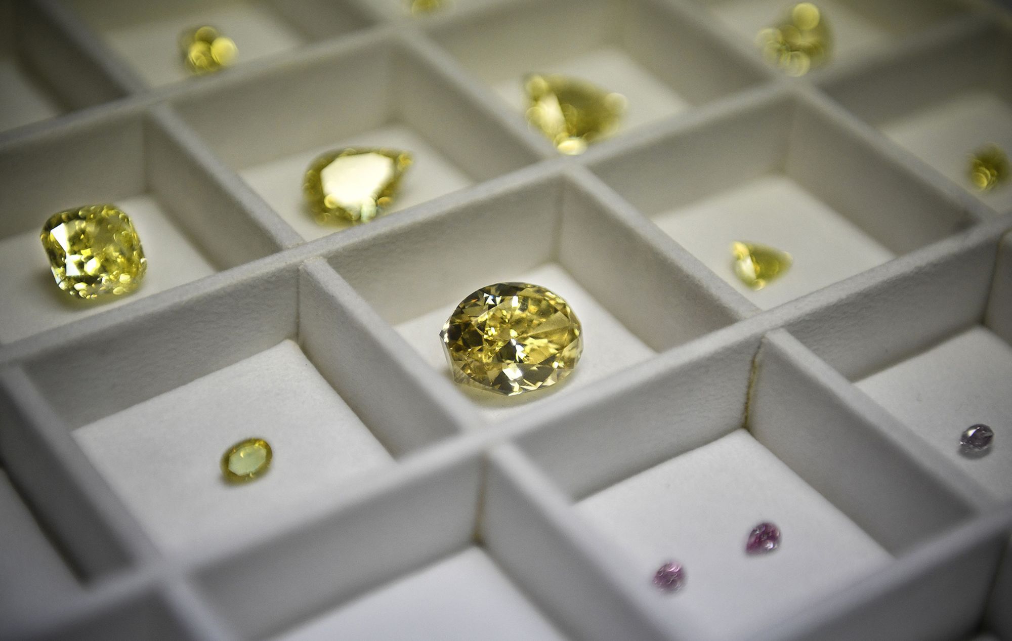 A display of diamonds, among other stones, at the Alrosa Diamond Cutting Division in Moscow on July 3, 2019.