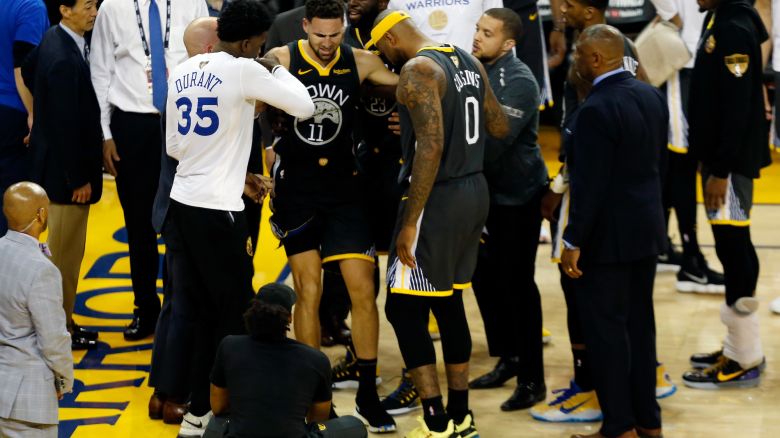 OAKLAND, CALIFORNIA - JUNE 13:  Klay Thompson #11 of the Golden State Warriors reacts after hurting his leg against the Toronto Raptors in the second half during Game Six of the 2019 NBA Finals at ORACLE Arena on June 13, 2019 in Oakland, California. NOTE TO USER: User expressly acknowledges and agrees that, by downloading and or using this photograph, User is consenting to the terms and conditions of the Getty Images License Agreement. (Photo by Lachlan Cunningham/Getty Images)
