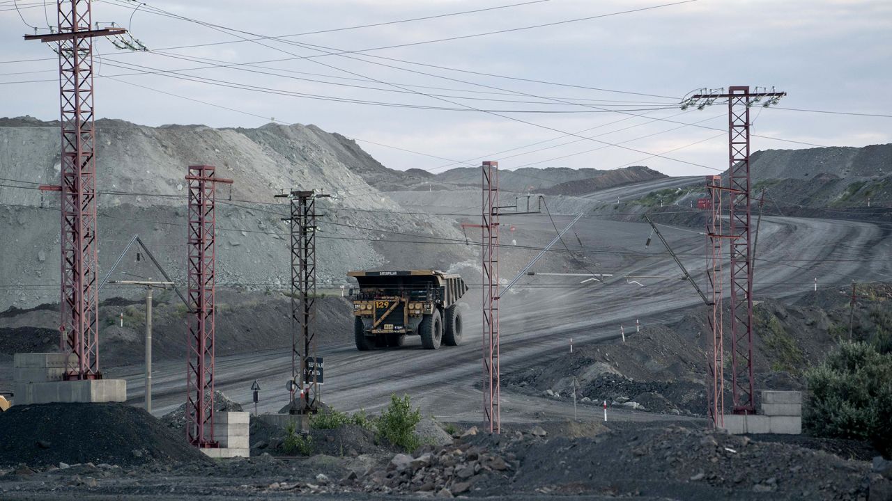 A dumper truck shifts iron ore from an excavation site, operated by Ferrexpo Plc, near Horishni Plavni, Ukraine, on Thursday, July 11, 2019. This weekend almost 200 seats  just under half of parliament  are being contested by oligarchs, sports stars, showbiz celebrities and activists with their own agendas, potentially complicating President Volodymyr Zelenskiys promise to overhaul Ukraine. Photographer: Evgeniy Maloletka/Bloomberg via Getty Images