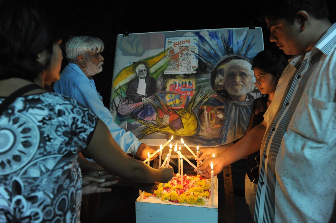 Indian artist Mahendra Jayantilal Kadia (second from left) and his students paying homage to Husain in Ahmedabad, India, following his death on June 9, 2011.