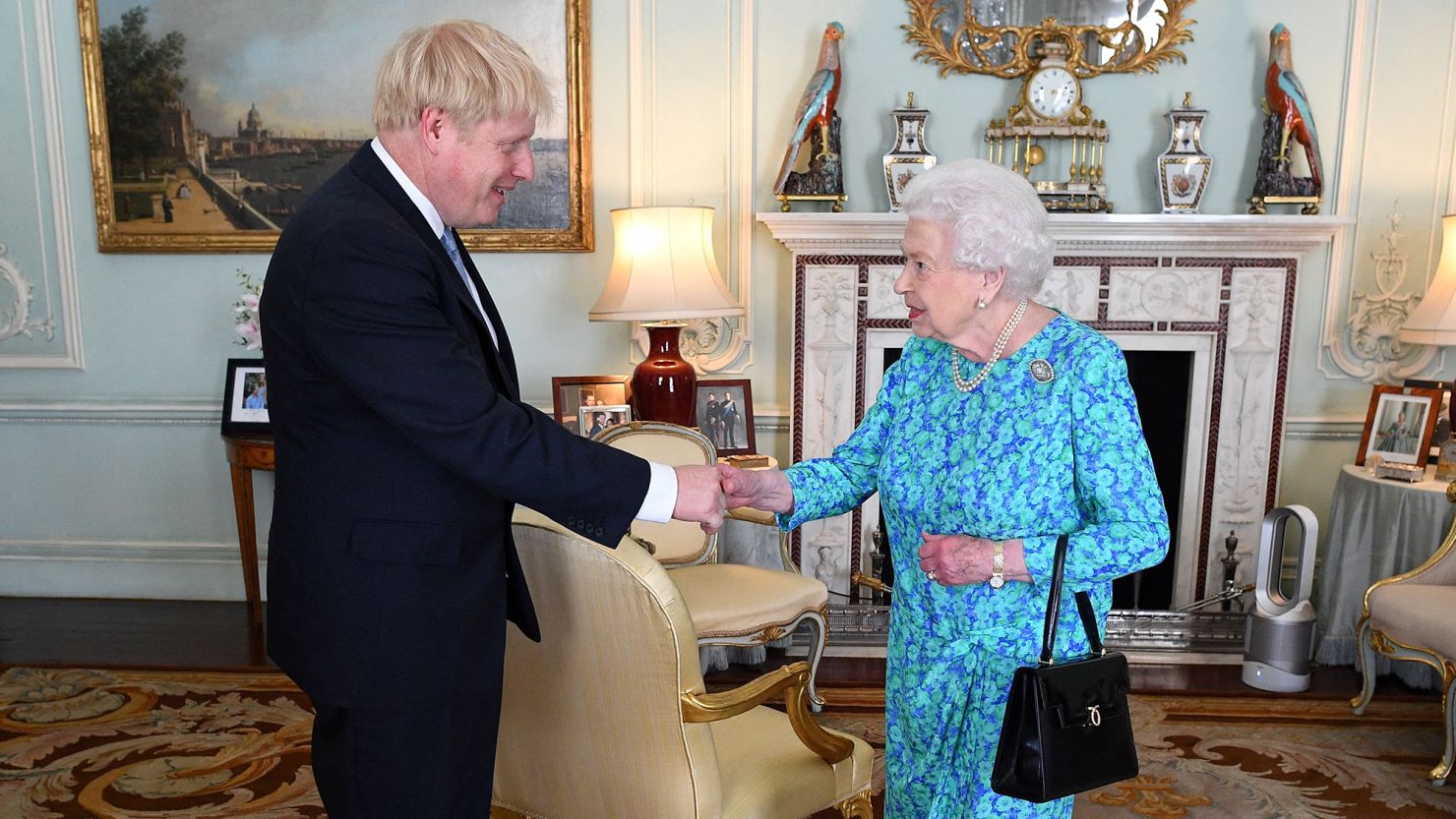 Britain's Queen Elizabeth II with Boris Johnson  during an audience in Buckingham Palace on July 24, 2019, shortly after his Conservative Party won in the UK general election. 