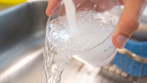 Tap water is seen in this photo illustration in Washington, DC, on August 19, 2019. - A study published on August 19, 2019 links exposure to fluoridated tap water during pregnancy to lower IQ scores in infants, but several outside experts expressed concern over its methodology and questioned its findings.  Fluoride has been added to community water supplies in industrial countries to prevent tooth decay since the 1950s. Very high levels of the mineral have been found to be toxic to the brain, though the concentrations seen in fluoridated tap water are generally deemed safe. (Photo by Alastair Pike / AFP)        (Photo credit should read ALASTAIR PIKE/AFP via Getty Images)