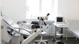 gynecological chair in a light gynecologist's office.