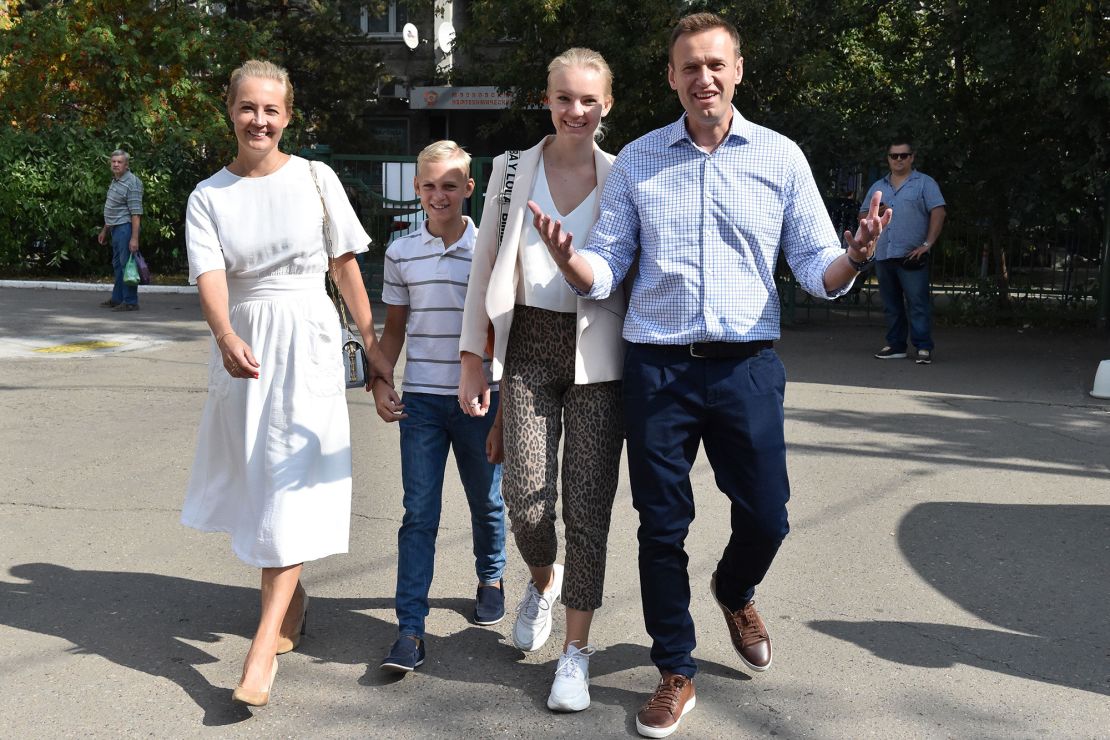 Navalny, right walks with his family to a polling station during the Moscow city Duma elections in 2019.