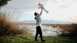 Father throws daughter in the air