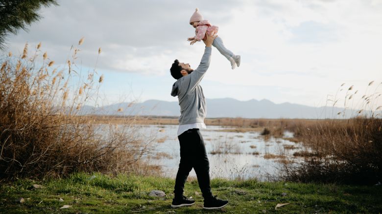 Father throws daughter in the air