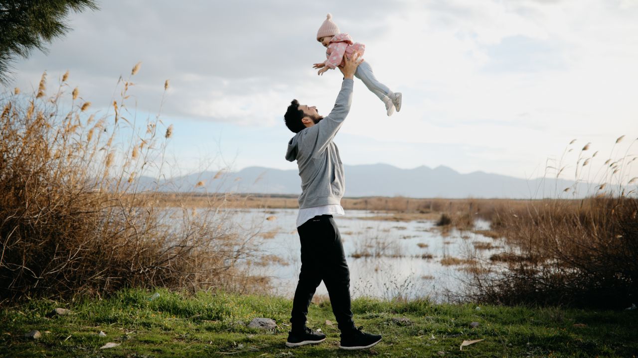 Father throws daughter in the air