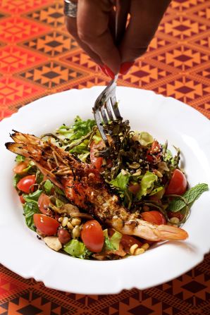 <strong>Laphet Thoke (Myanmar): </strong>This pickled tea leaf salad helps keep things cool in steamy Myanmar. It's a smoky and bitter combination of fresh veggies, fried garlic, green chiles, crunchy roasted peanuts, fried beans, dried shrimp and toasted sesame seeds.