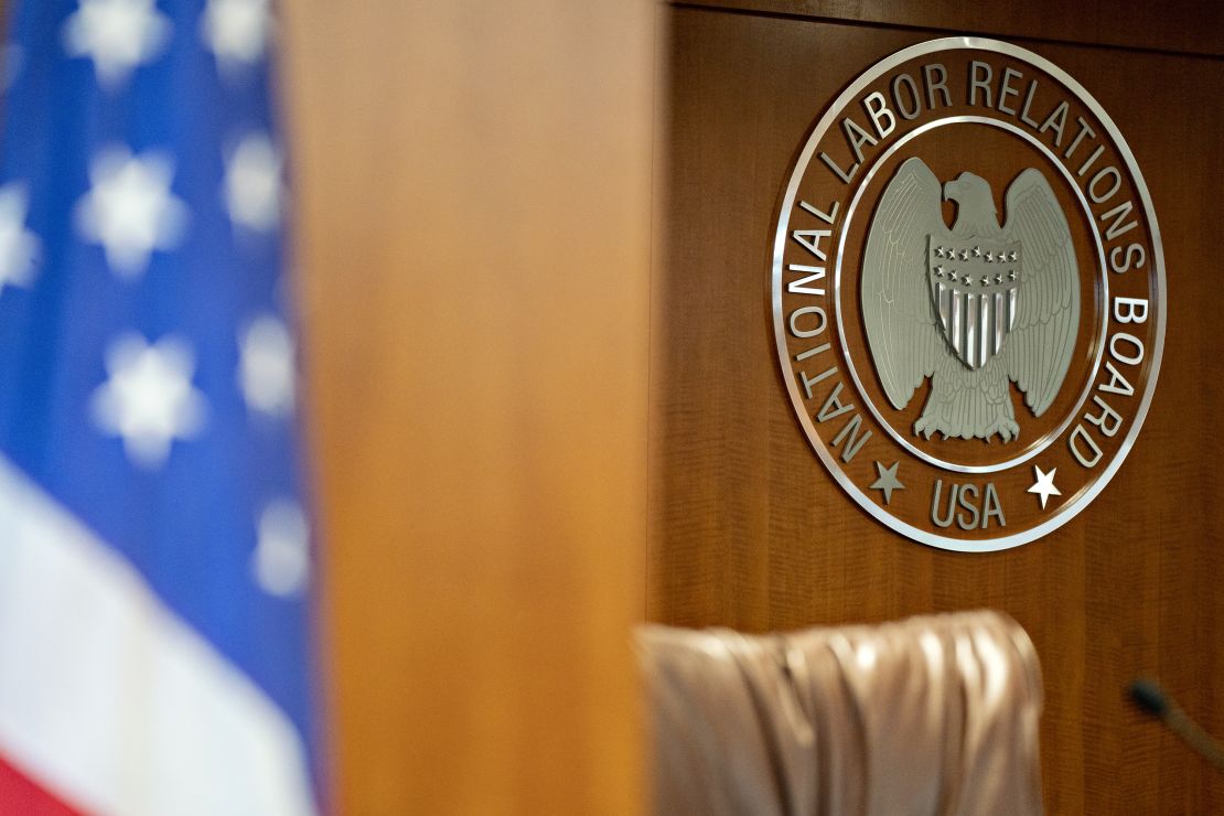 The National Labor Relations Board seal hangs inside a hearing room at the agency's headquarters in Washington, DC.