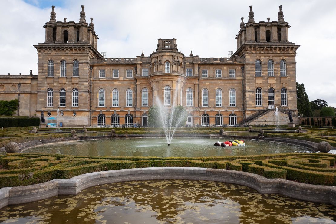 "Daddy, Daddy", a large scale recreation of the drowning Disney character Pinocchio, created by artist Maurizio Cattelan, is seen in a pool at Blenheim Palace on September 12, 2019. The golden toilet, titled "America," was part of the same exhibition at the stately home.