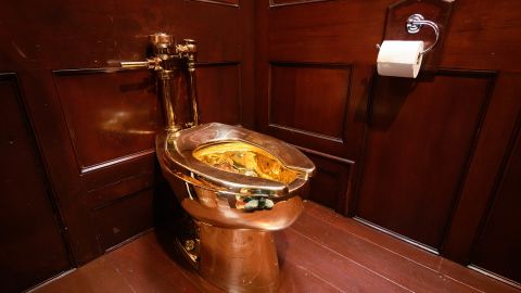 WOODSTOCK, ENGLAND - SEPTEMBER 12: "America", a fully-working solid gold toilet, created by artist Maurizio Cattelan, is seen at Blenheim Palace on September 12, 2019 in Woodstock, England.  The Italian artist is known as the prankster of the art world.  His most notable piece being "America" a solid gold usable toilet which had art lovers queuing to use when it was shown at the Guggenheim Museum in New York. (Photo by Leon Neal/Getty Images)