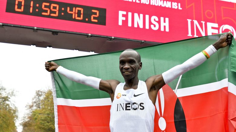 Kenya's Eliud Kipchoge celebrates in the finish area of a special course after busting the mythical two-hour barrier for the marathon on October 12 2019 in Vienna. - With a timing of 1hr 59min 40.2sec, the Olympic champion became the first ever to run a marathon in under two hours. (Photo by HERBERT NEUBAUER / APA / AFP) / RESTRICTED TO EDITORIAL USE (Photo by HERBERT NEUBAUER/APA/AFP via Getty Images)