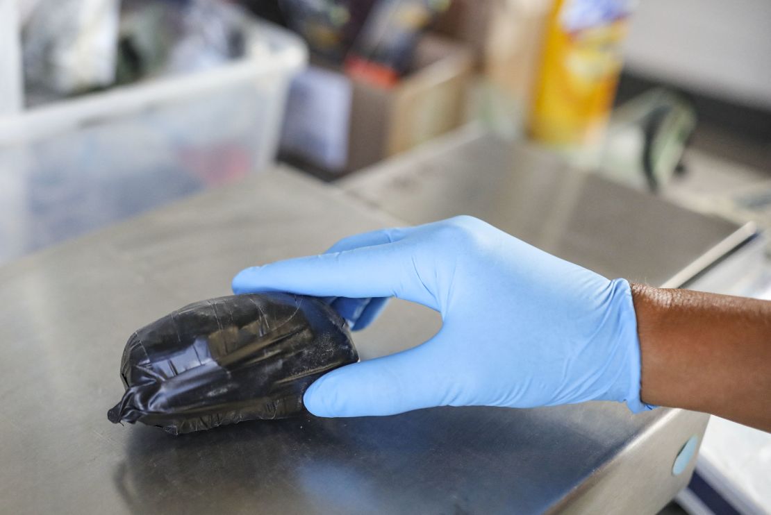 A US Customs and Border Protection agent weighs a package of fentanyl at the San Ysidro port of entry in California in 2019.