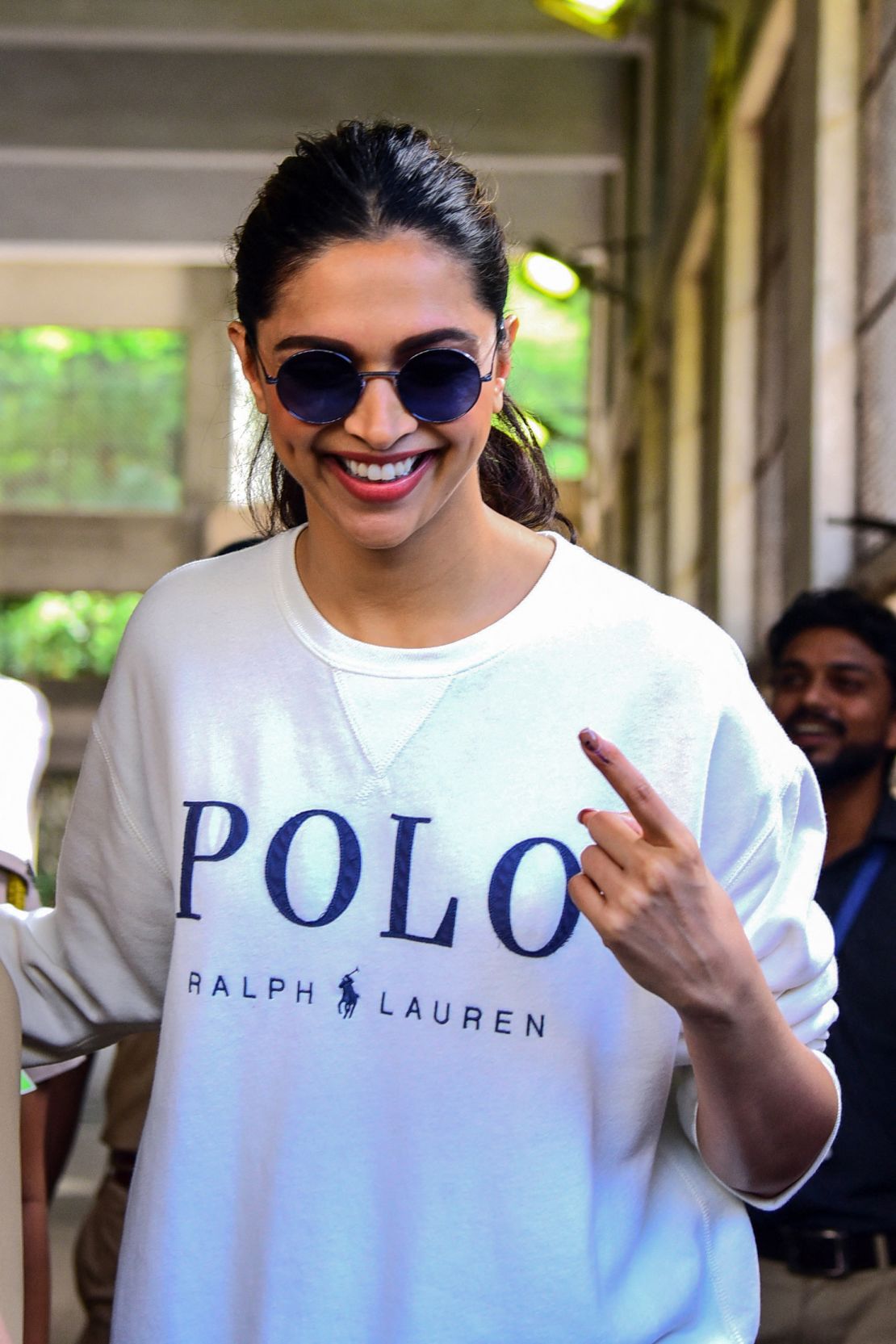 Bollywood actress Deepika Padukone shows her inked finger after casting her vote at a polling station during the state assembly election in Mumbai on October 21, 2019.
