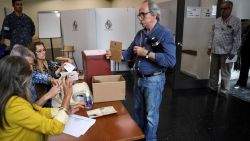 A man casts his ballot at a polling station during Uruguay's general election in Montevideo on October 27, 2019. - Polls opened in Uruguay on October 27 to elect a president to succeed leftist Tabare Vazquez. The two favorites to reach the second round are the Broad Front's Daniel Martinez, the former mayor of Montevideo, and senator Luis Lacalle Pou of the center-right National Party. Uruguayans will also be electing all 99 deputies and 30 senators in parliament. (Photo by EITAN ABRAMOVICH / AFP) (Photo by EITAN ABRAMOVICH/AFP via Getty Images)