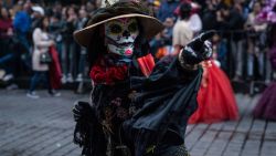 MEXICO CITY, MEXICO - NOVEMBER 02: A performer participates in the Day of the Dead parade on Paseo de la Reforma Avenue on November 2, 2019 in Mexico City, Mexico. Observants celebrate the Day of the Dead in honor of of those who have passed away, temporarily welcoming their spirits back to the land of the living. (Photo by Toya Sarno Jordan/Getty Images)