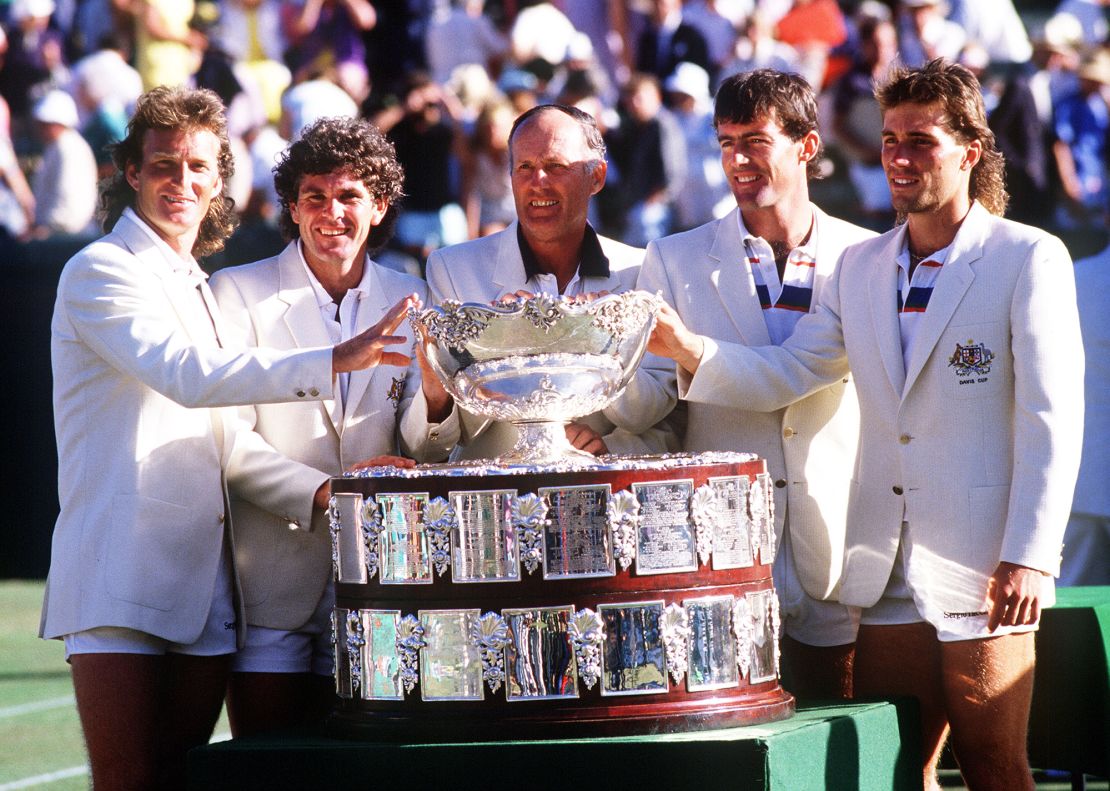 Peter McNamara, Paul McNamee, Neale Fraser (captain), John Fitzgerald and Pat Cash of Australia celebrate with the Davis Cup in 1986, having beaten Sweden in the final.