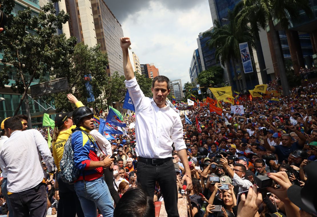 CARACAS, VENEZUELA - NOVEMBER 16: Opposition leader Juan Guaido, recognized by many members of the international community as the country's rightful interim ruler, greets supporters in front of the Bolivian Embassy during a rally called "Wake up, Venezuela" to boost pressure on President Nicolas Maduro to resign on November 16, 2019 in Caracas, Venezuela. Last night an unidentified group of armed people dressing military uniforms broke into the headquarters of Juan Guaido's party Voluntad Popular. Guaido's call for renewed protests came as political turmoil affect countries across the region forcing leaders into concessions and even contributing to Evo Morales resignation under pressure. Guaido is willing to bring new energy as frustration grew after inability to remove Maduro from Power. (Photo by Edilzon Gamez/Getty Images)