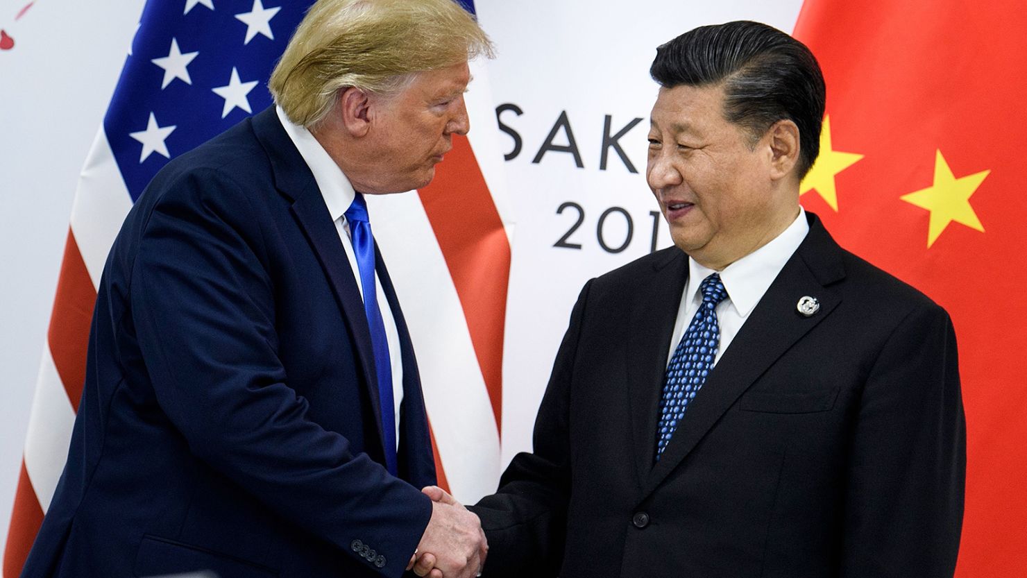 China's President Xi Jinping shakes hands with US President-elect Donald Trump during his first White House term, on the sidelines of the G20 Summit in Osaka in 2019.