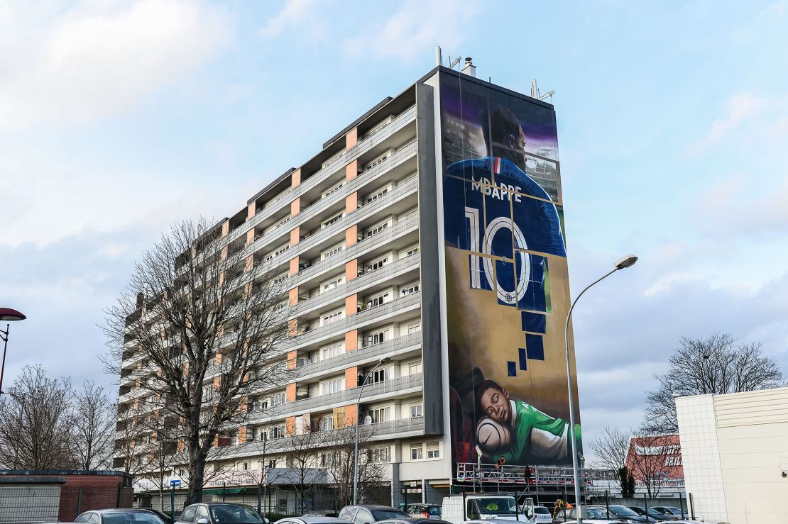 A giant street art mural on the facade of a building represents Kylian Mbappé in Bondy, his hometown, on December 17, 2019.