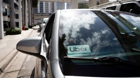 An Uber sticker is seen on a car windshield on the street in downtown Miami on January 9, 2020.