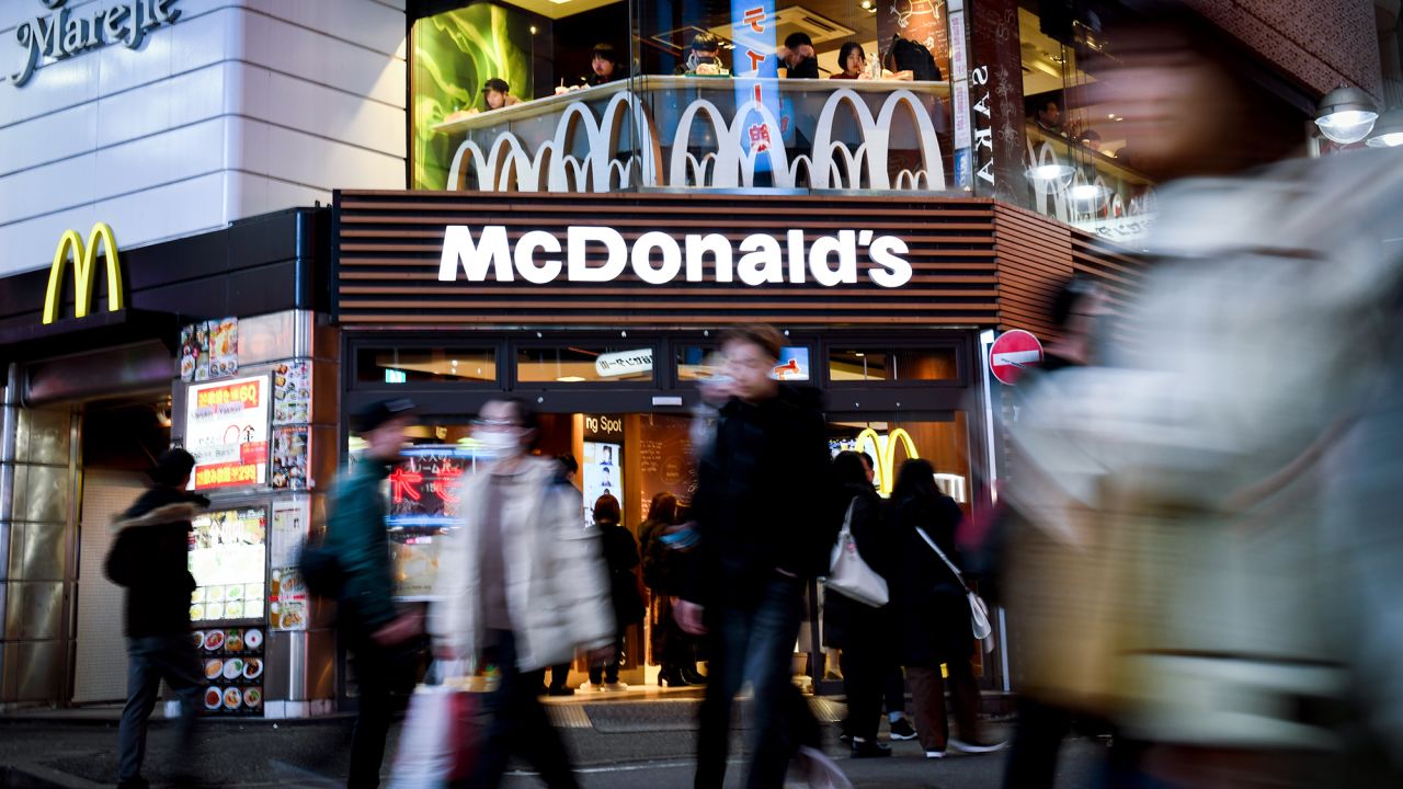 Pedestrians walk past a McDonald's Corp. restaurant in the Shibuya district of Tokyo, Japan, on Monday, Jan. 20, 2020. Japans key measure of inflation rose at the fastest rate since May, with a higher sales tax boosting prices for a third month and a less-pronounced drop in gas prices also buoying the figure. Photographer: Noriko Hayashi/Bloomberg via Getty Images