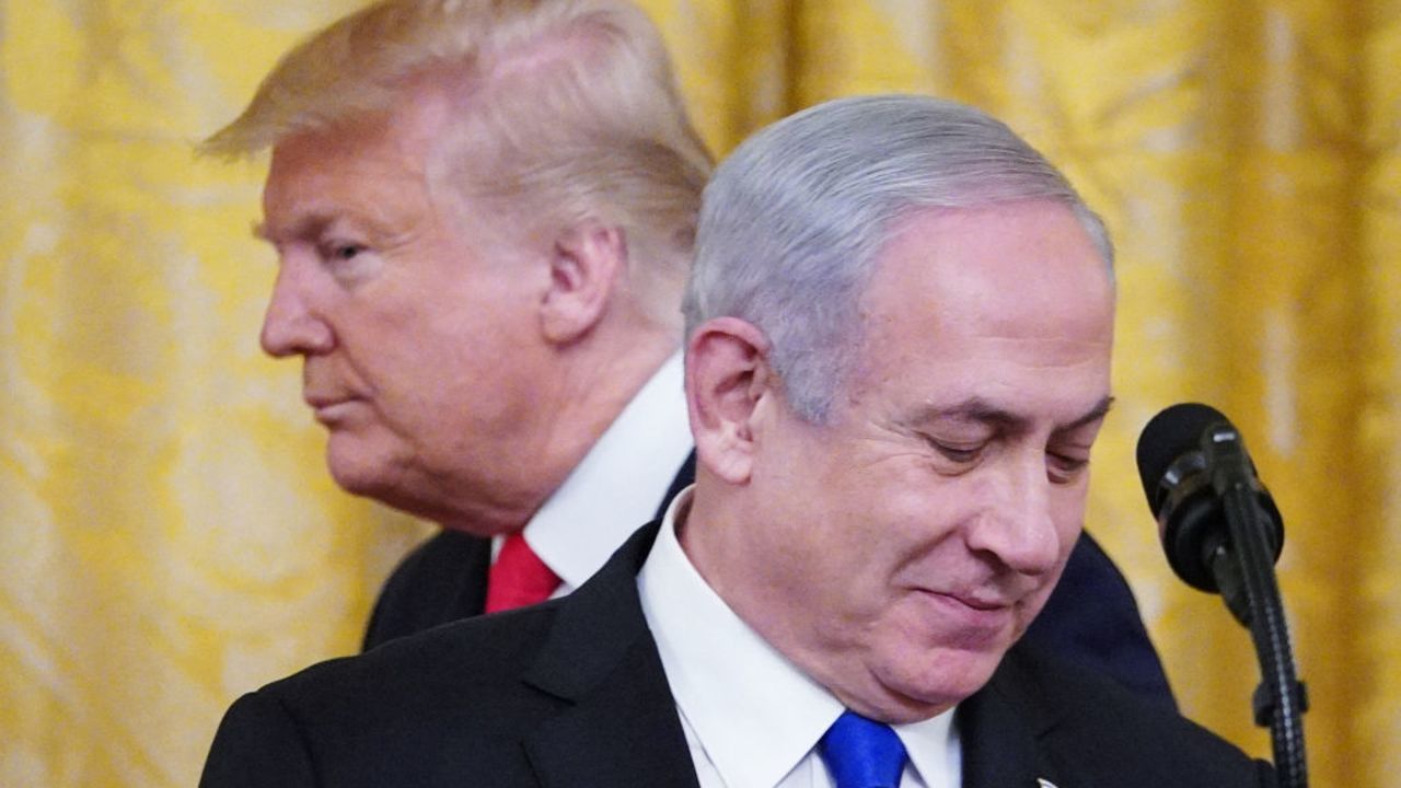 TOPSHOT - US President Donald Trump and Israel's Prime Minister Benjamin Netanyahu take part in an announcement of Trump's Middle East peace plan in the East Room of the White House in Washington, DC on January 28, 2020. Trump declared that Israel was taking a "big step towards peace" as he unveiled a plan aimed at solving the Israeli-Palestinian conflict. "Today, Israel takes a big step towards peace," Trump said, standing alongside Netanyahu as he revealed details of the plan already emphatically rejected by the Palestinians. (Photo by MANDEL NGAN / AFP) (Photo by MANDEL NGAN/AFP via Getty Images)