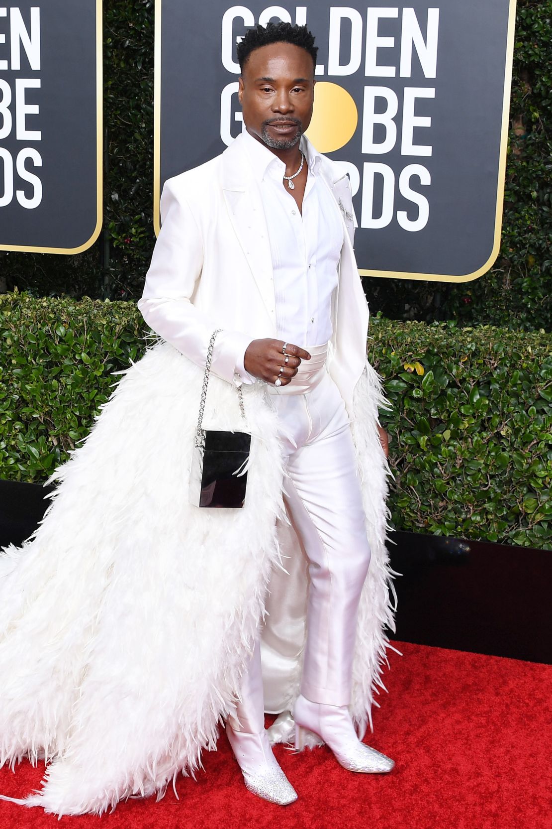 Billy Porter on the red carpet for the Golden Globes in 2020 in an all-white outfit.