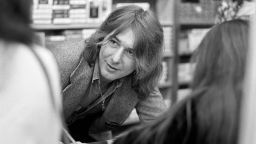 Bad Company guitarist Mick Ralphs signs autographs at a Bad Company instore appearance at Peaches Records on March 31, 1976 in Atlanta, Georgia.