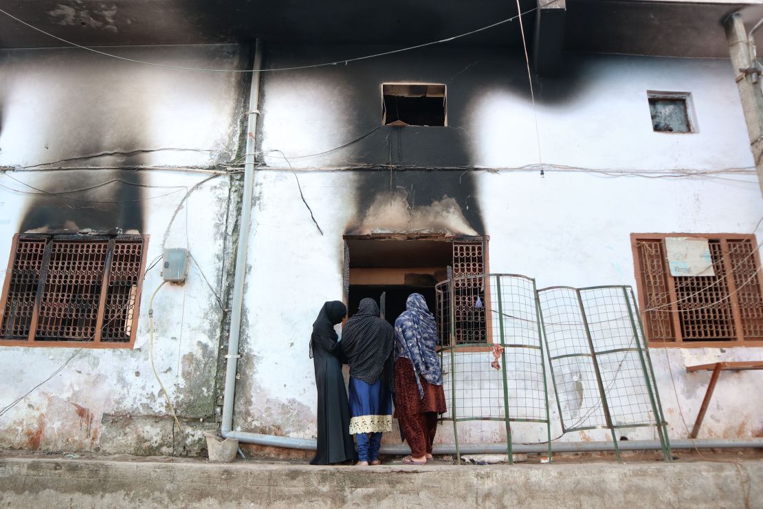 Muslims look inside a charred mosque after it was set on fire by a mob during riots in the Mustafabad area of New Delhi on February 29, 2020.