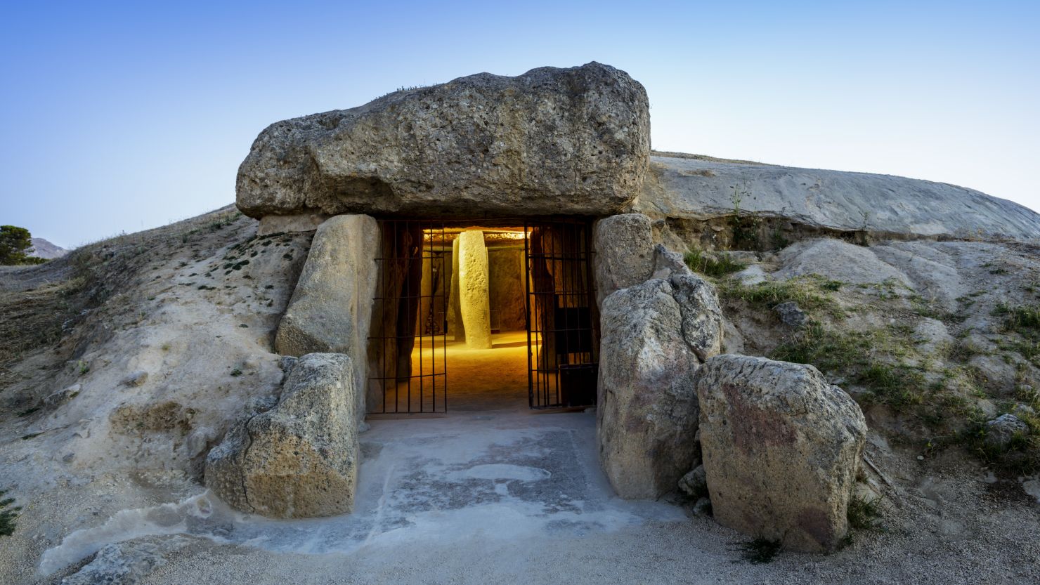 A narrow entrance leads into the Menga Dolmen, a prehistoric stone monument built at least 5,600 years ago.