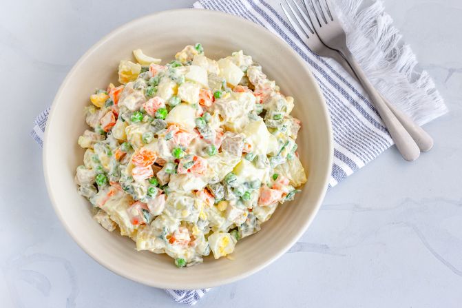 <strong>Olivier salad (Russia): </strong>This traditional Russian potato salad named for its creator, 19th-century chef Lucien Olivier, is often customized with add-ons like veggies (carrots, peas and sweet pickles), eggs and ham (or chicken, or even bologna) — plus mayo.