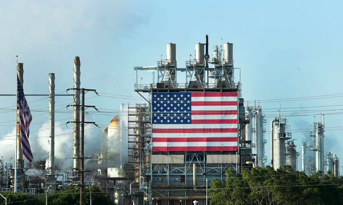 TOPSHOT - The US flag is displayed at the Wilmington Oil Fields south of Los Angeles, California on April 21, 2020, a day after oil prices dropped to below zero as the oil industry suffers steep falls in benchmark crudes due to the ongoing global coronavirus pandemic. - President Donald Trump on Tuesday ordered his administration to come up with a plan to aid US oil companies struggling with a massive supply glut and record-low crude prices. "We will never let the great U.S. Oil & Gas Industry down," Trump tweeted. (Photo by Frederic J. BROWN / AFP) (Photo by FREDERIC J. BROWN/AFP via Getty Images)