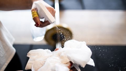 DINSLAKEN, GERMANY - MARCH 15: An athlete cleans the equipment with disinfectant after a CrossFit class at CrossFit Hiesfeld on March 15, 2020 in Dinslaken, Germany. As the number of confirmed cases of coronavirus infection continues to rise daily across Germany so is the impact of the virus on everyday life. Businesses are increasing home office work, airlines are decreasing their flight capacity, schools with cases of the virus are closing temporarily, some sports events are void of spectators, shops are selling out of disinfectants and large-scale public events are being cancelled. (Photo by Lars Baron/Getty Images)