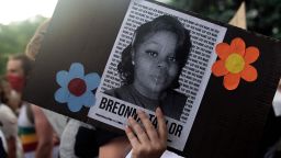 A demonstrator holds a sign with the image of Breonna Taylor, a black woman who was fatally shot by Louisville Metro Police Department officers, during a protest against the death George Floyd in Minneapolis, in Denver, Colorado on June 3, 2020.
